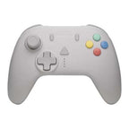 Light gray game controller with D‑pad and colored buttons.
