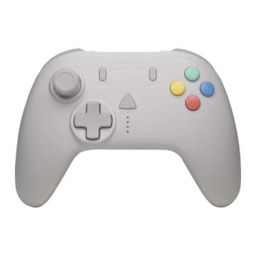 Light gray game controller with D‑pad and colored buttons.
