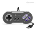 A gray Hyperkin 'Scout' Premium SNESÂ®-Style USB Controller with a wired connection and purple buttons.