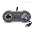 A gray Hyperkin 'Scout' Premium SNESÂ®-Style USB Controller with a wired connection and purple buttons.