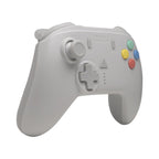 Retro Fighters wireless controller in white, angled view showing analog stick, D-pad, turbo buttons, and colorful action buttons for retro gaming.