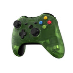 Green gaming controller with colored buttons on a white background
